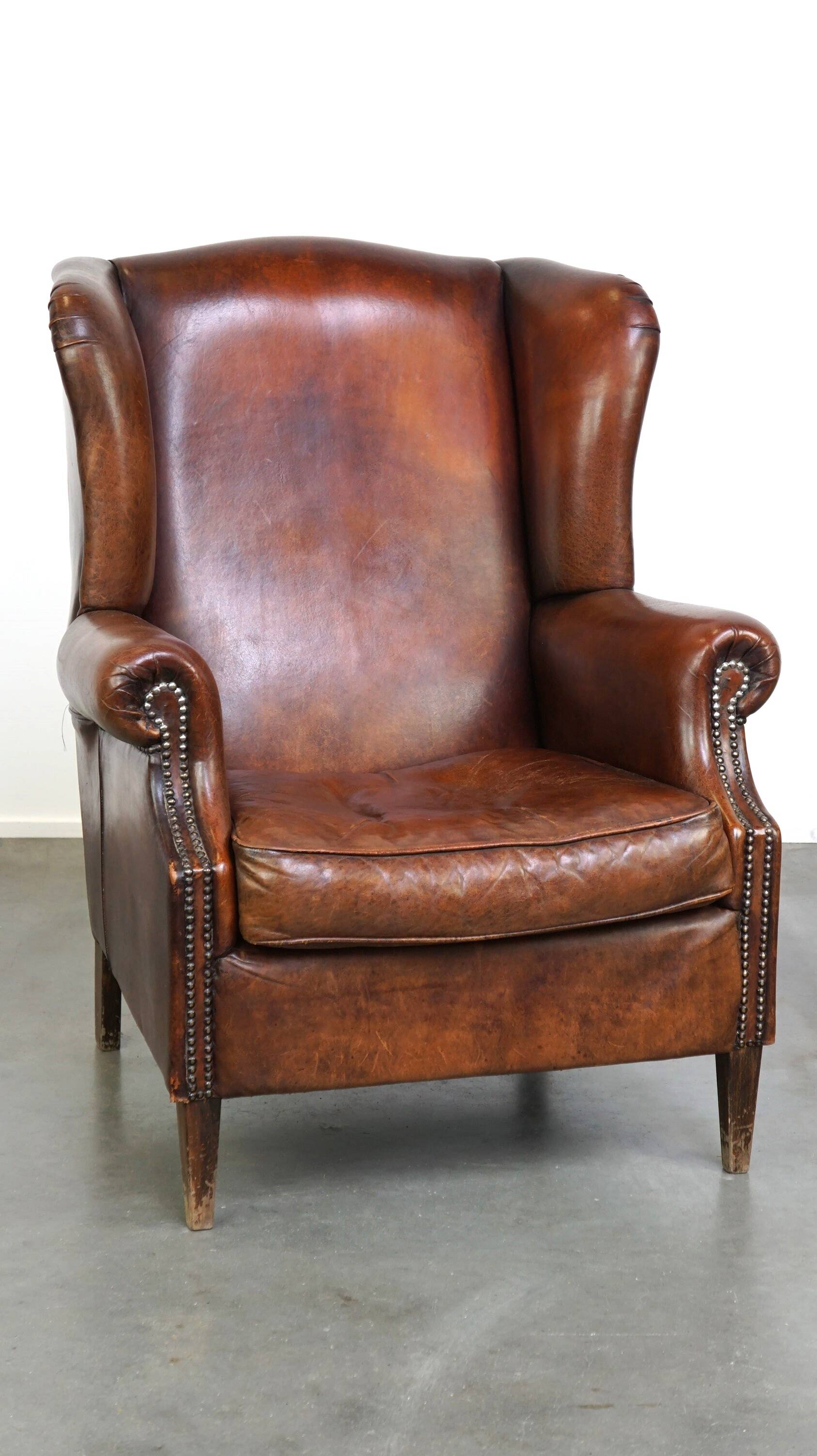 Large sheepskin wing chair with excellent colour and great seating comfort