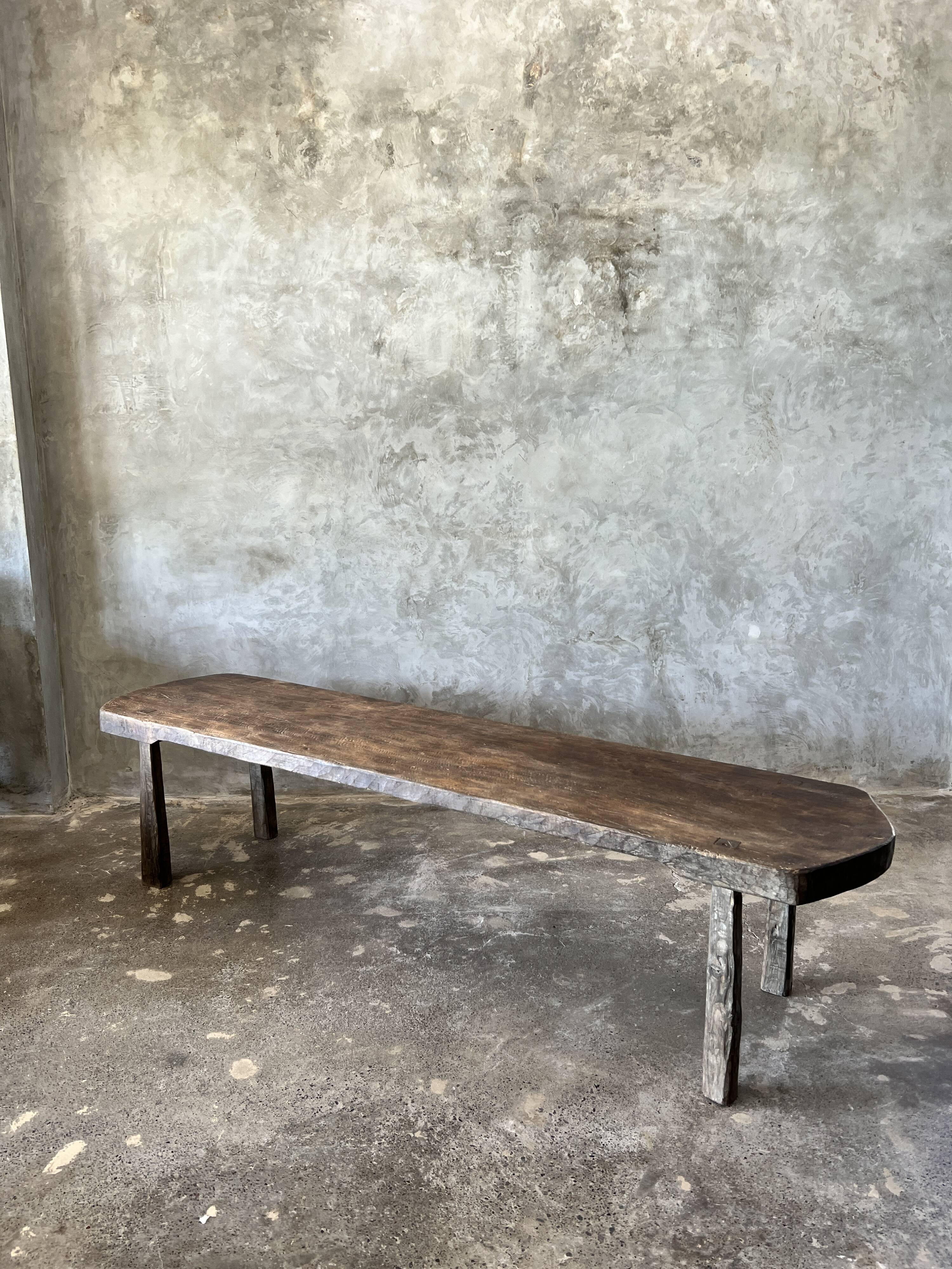 Large rounded coffee table in old Asian teak