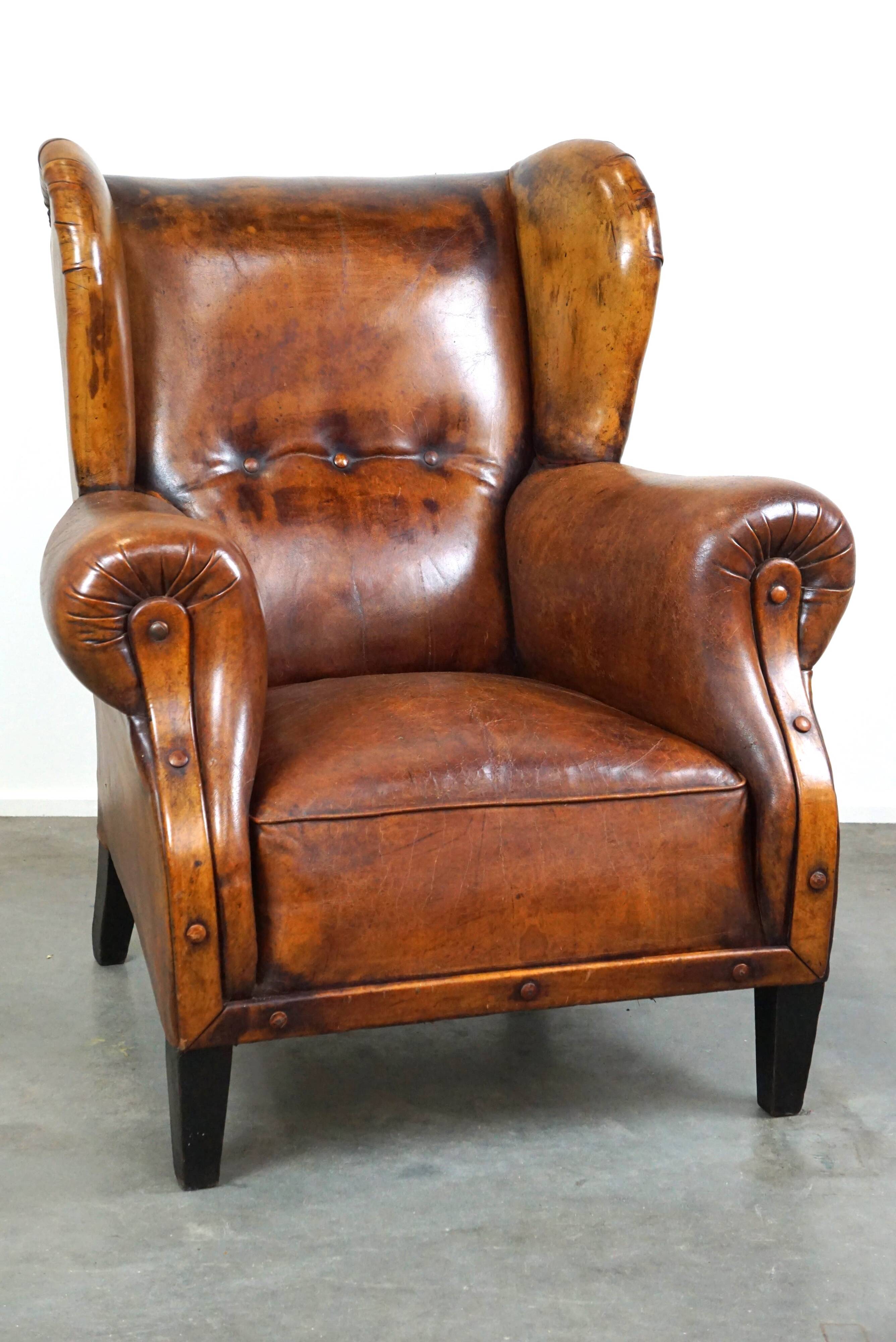 Irresistible old sheep leather wingback armchair with the most beautiful colors