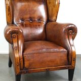 Irresistible old sheep leather wingback armchair with the most beautiful colors