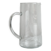 Glass pitcher with decoration of engraved ears of wheat.