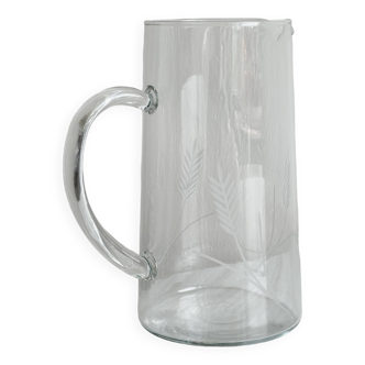 Glass pitcher with decoration of engraved ears of wheat.