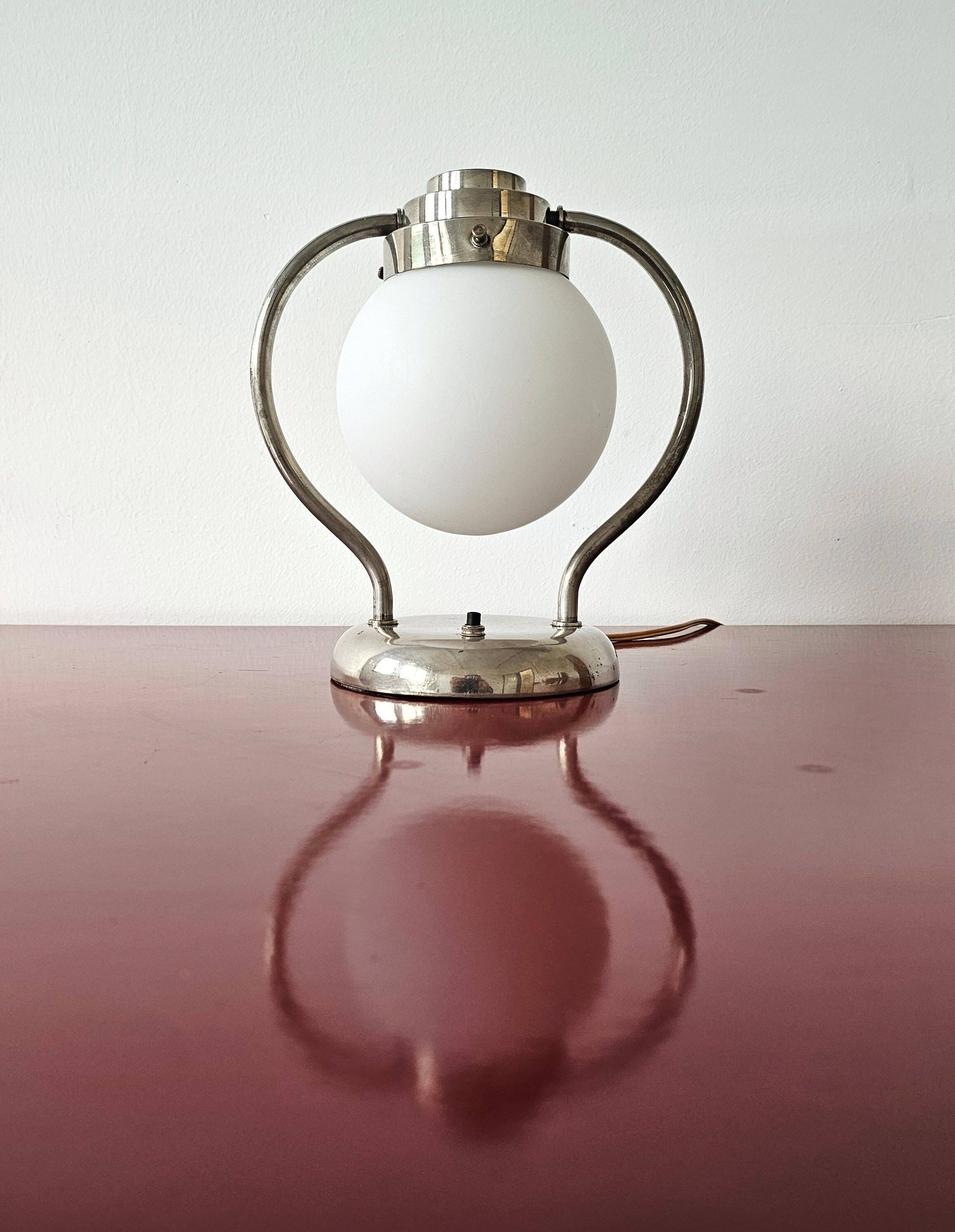 Art Deco table lamp with a spherical opaline glass shade and chrome base from the 1930s.