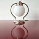 Art Deco table lamp with a spherical opaline glass shade and chrome base from the 1930s.