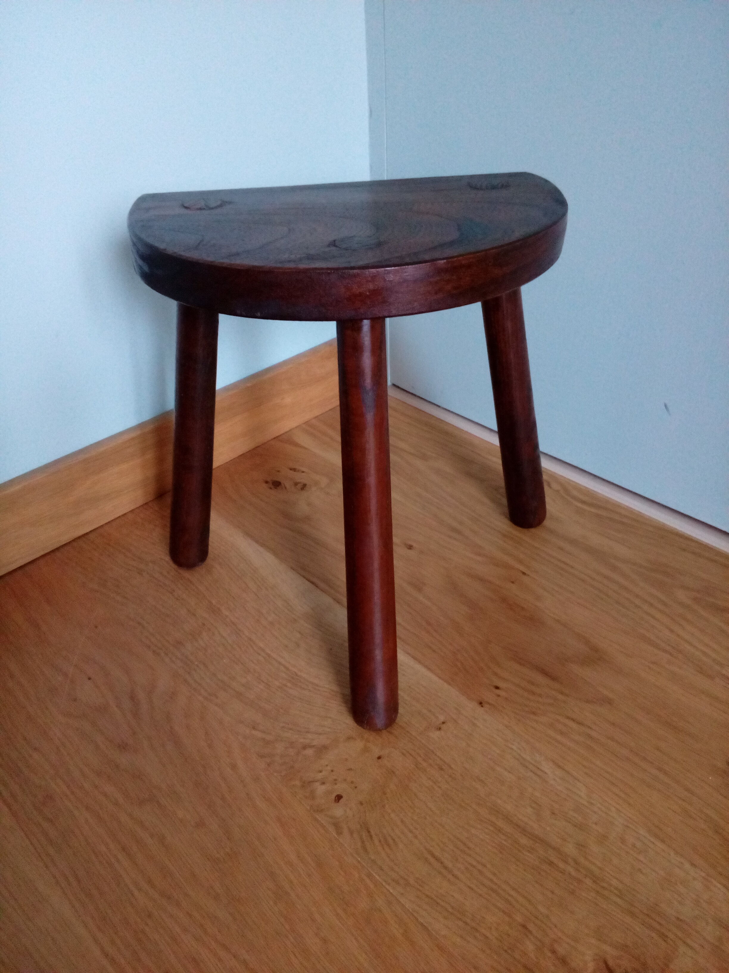 Tripod cowhide farm stool
