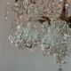 Bronze cage chandelier adorned with molded glass pendants in the shape of peacock feathers, circa 1800