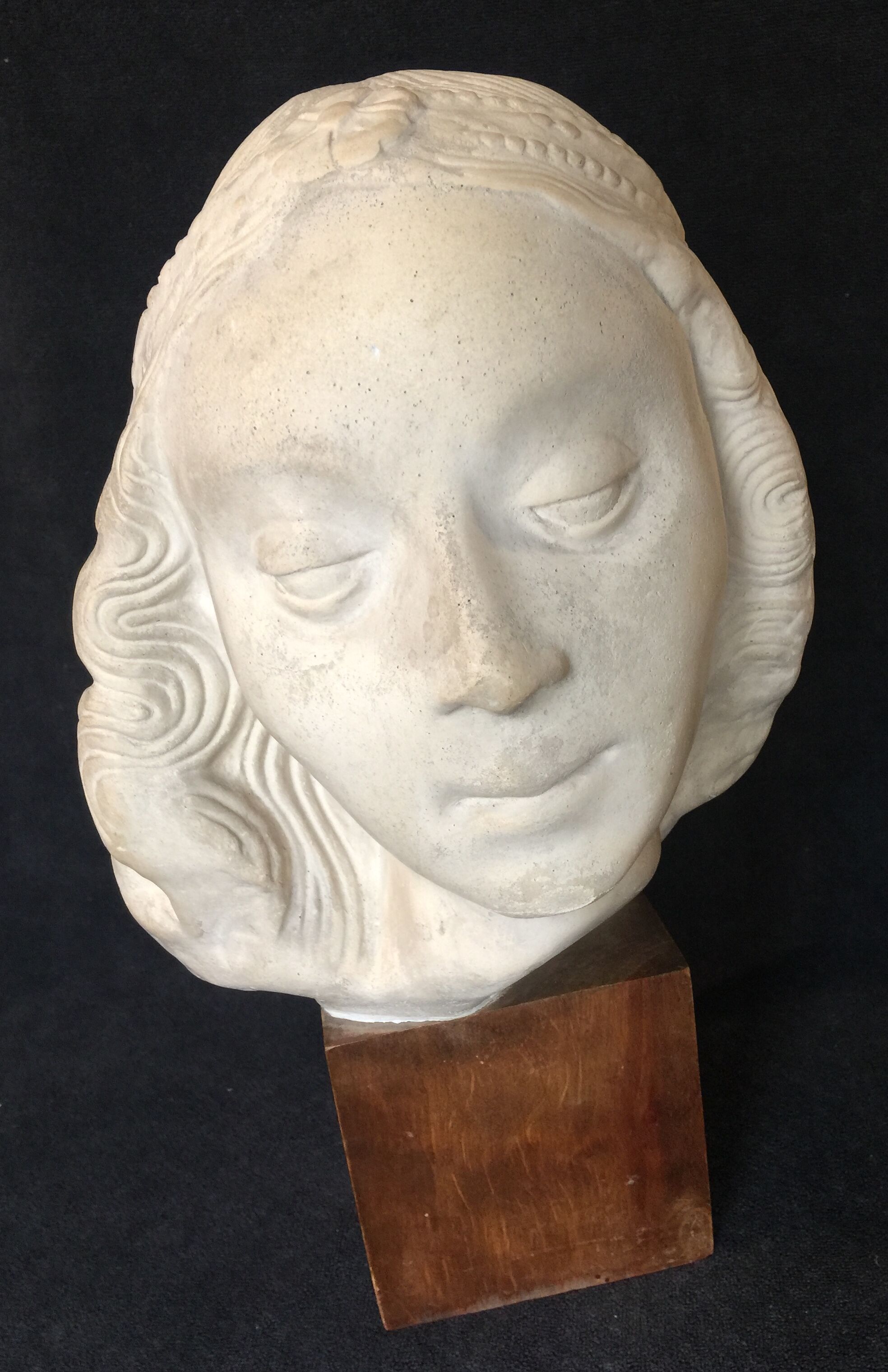 Bronze-middle-aged woman's head in plaster