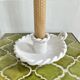 Hand-held candle holder with braided ceramic bowl
