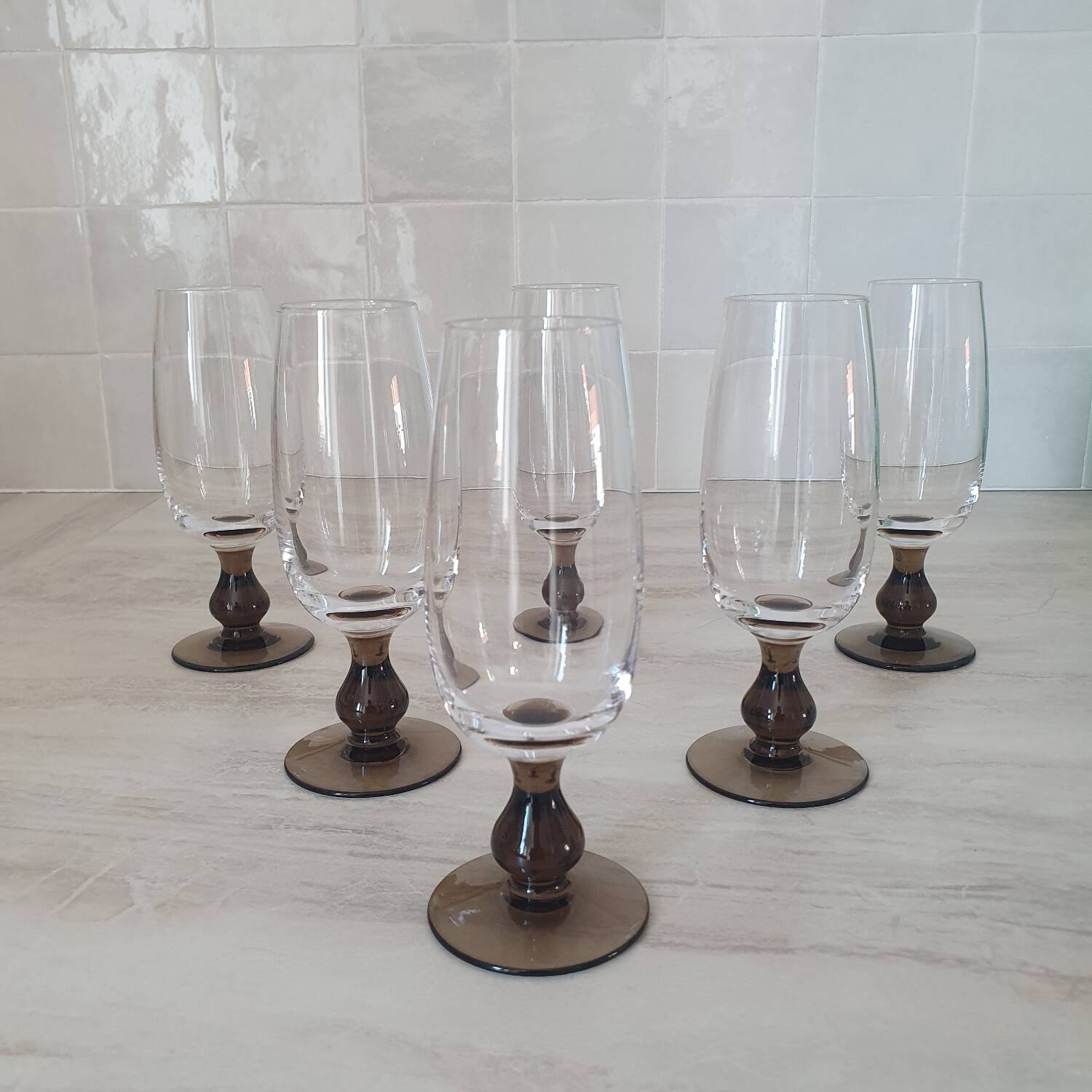 Champagne flutes with smoked brown glass feet