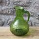 Antique vintage pitcher in green molded glass with floral relief - retro decoration