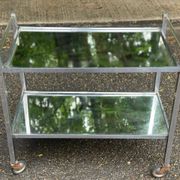Vintage rolling bar from the 1970s in chrome metal and mirror.