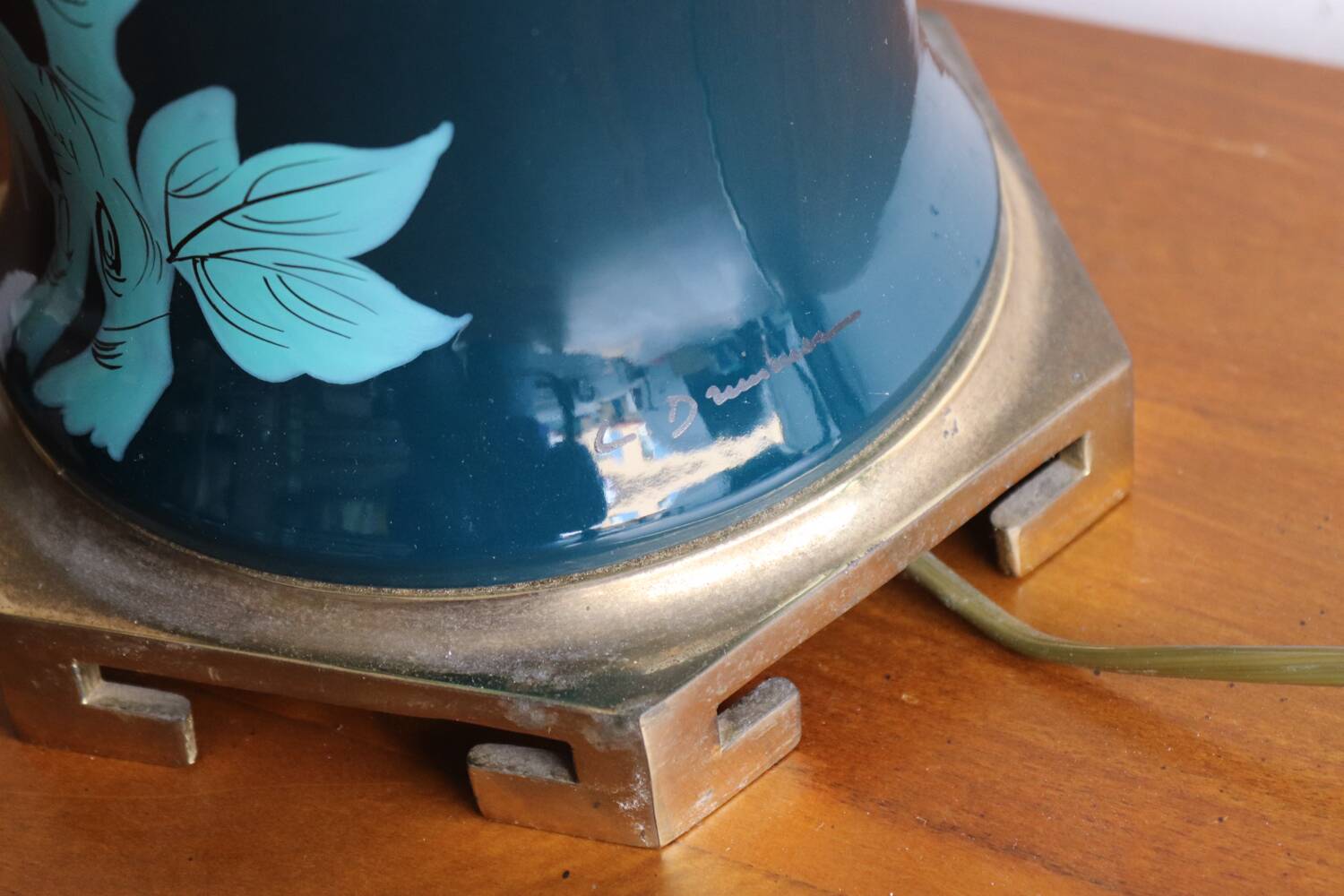 Vintage ceramic lamp with floral decoration.