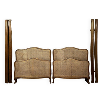 Pair of Louis XV style center beds in walnut and cane base circa 1900