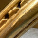 Small corner console in resin with a gold finish.