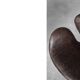 Brown leather Swan chair by Arne Jacobsen, mid-century Danish modernity.