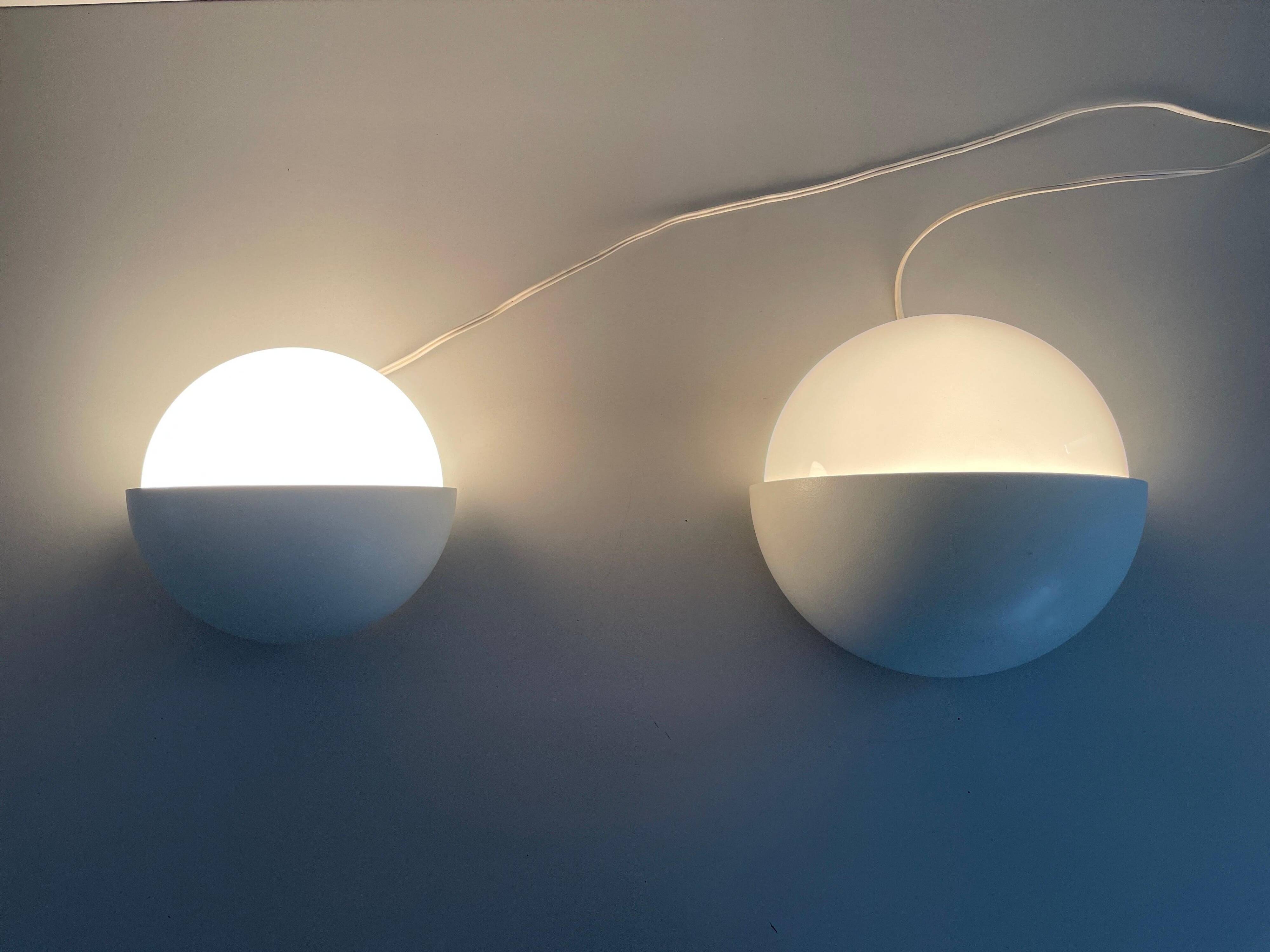 Round wall lights, small and large, in white metal by Bega, 1970s, Germany.