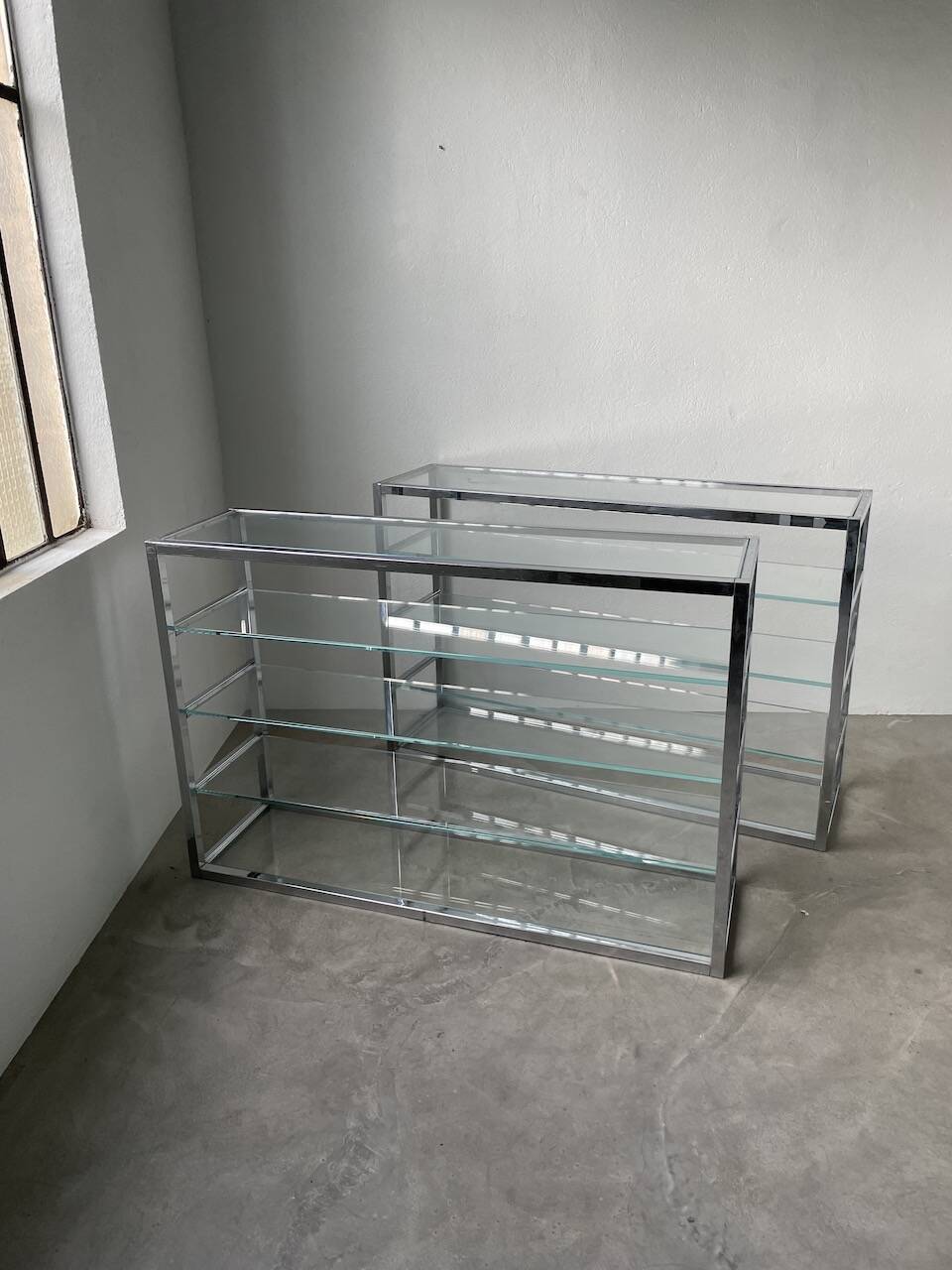 Pair of chrome and glass shelves from the 70s