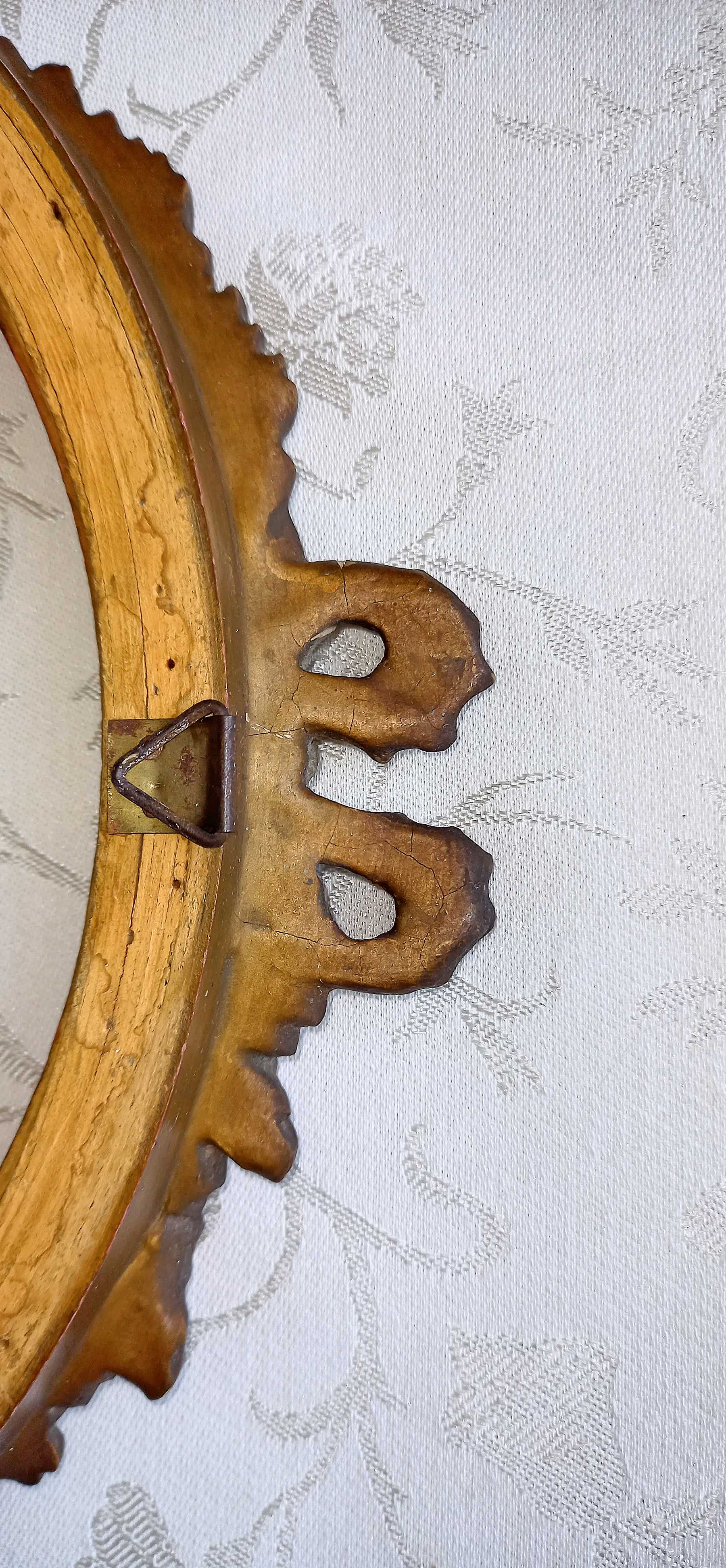 Oval frame with gilded pediments 19th wood and stucco