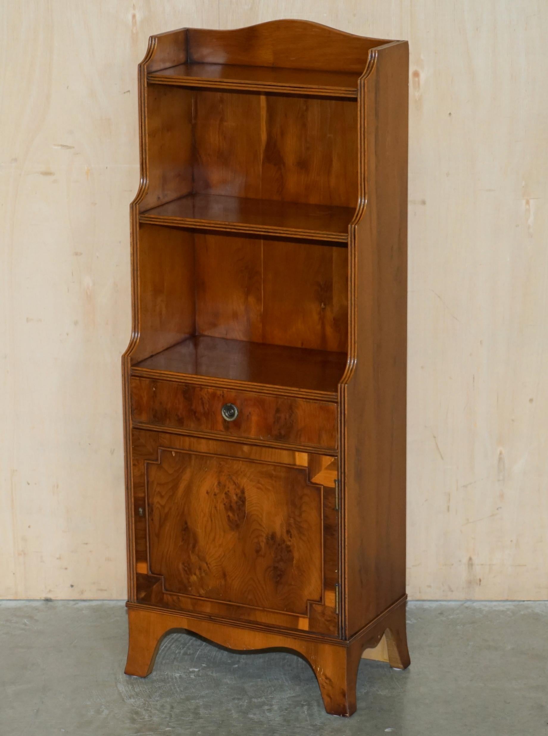 Pair of vintage English hardwood bookcases in a cascade style with cupboards.