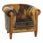 Fauteuil club Chesterfield en patchwork de tissus uniques dans le style anglais.