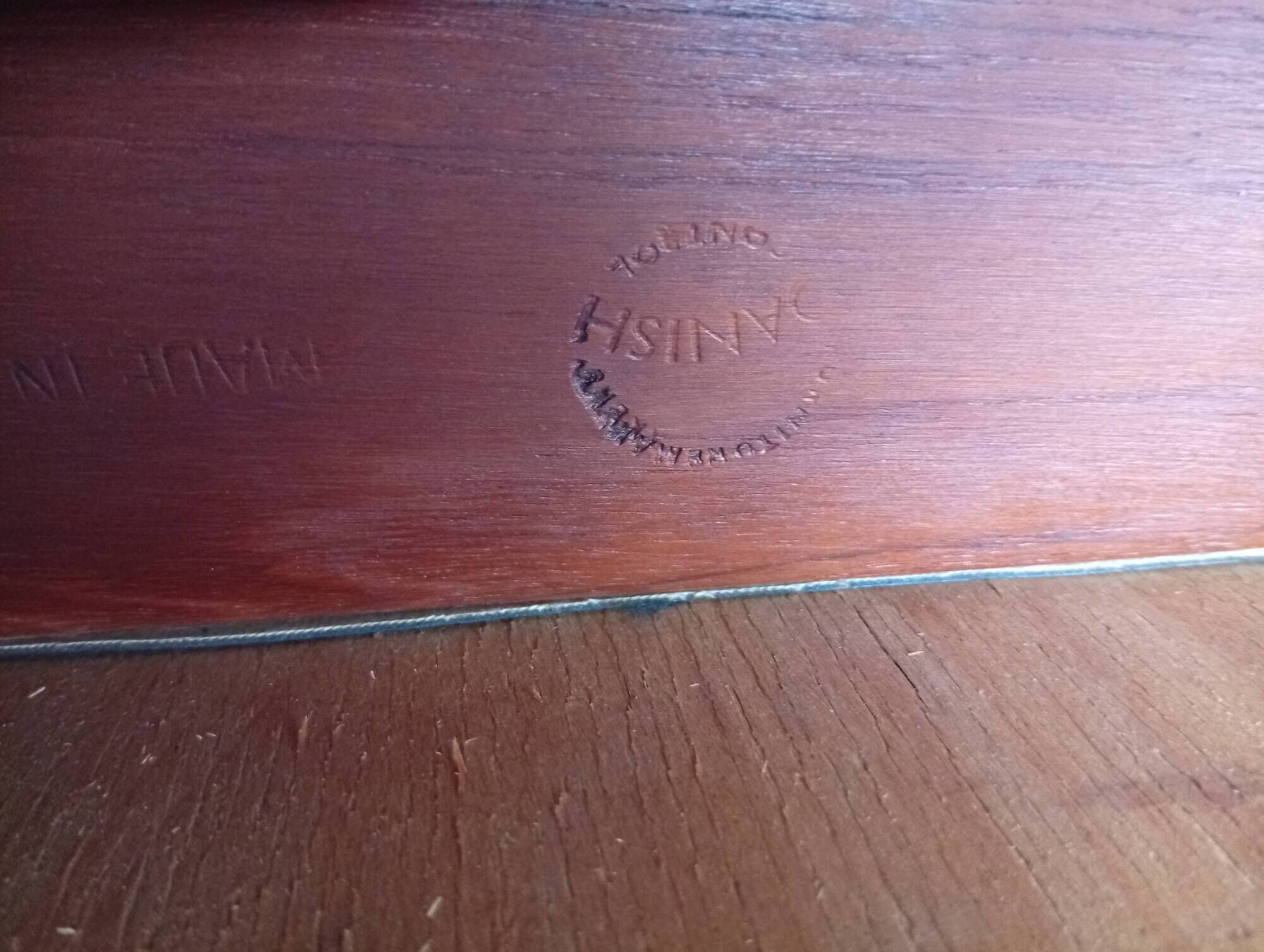 Four Danish mid-century teak armchairs.