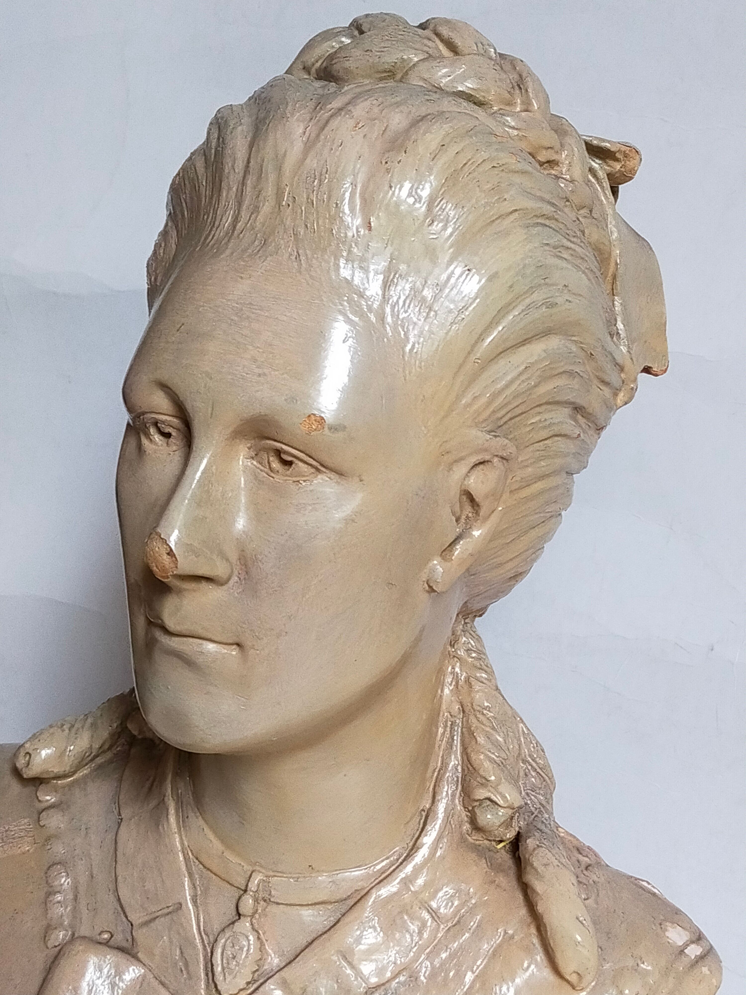 Bust of a woman "the elegant"XIXth in painted plaster signed on its solid wood base