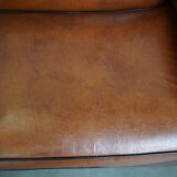 Very beautiful complete set consisting of a sheepskin leather sofa and two armchairs in cognac color