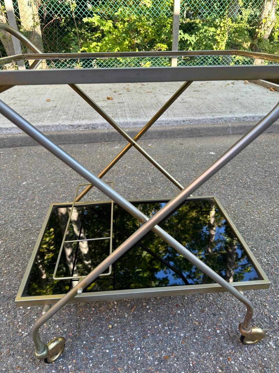 Mid-Century 1978 brass and black smoked glass wheeled dessert trolley.