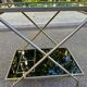 Mid-Century 1978 brass and black smoked glass wheeled dessert trolley.