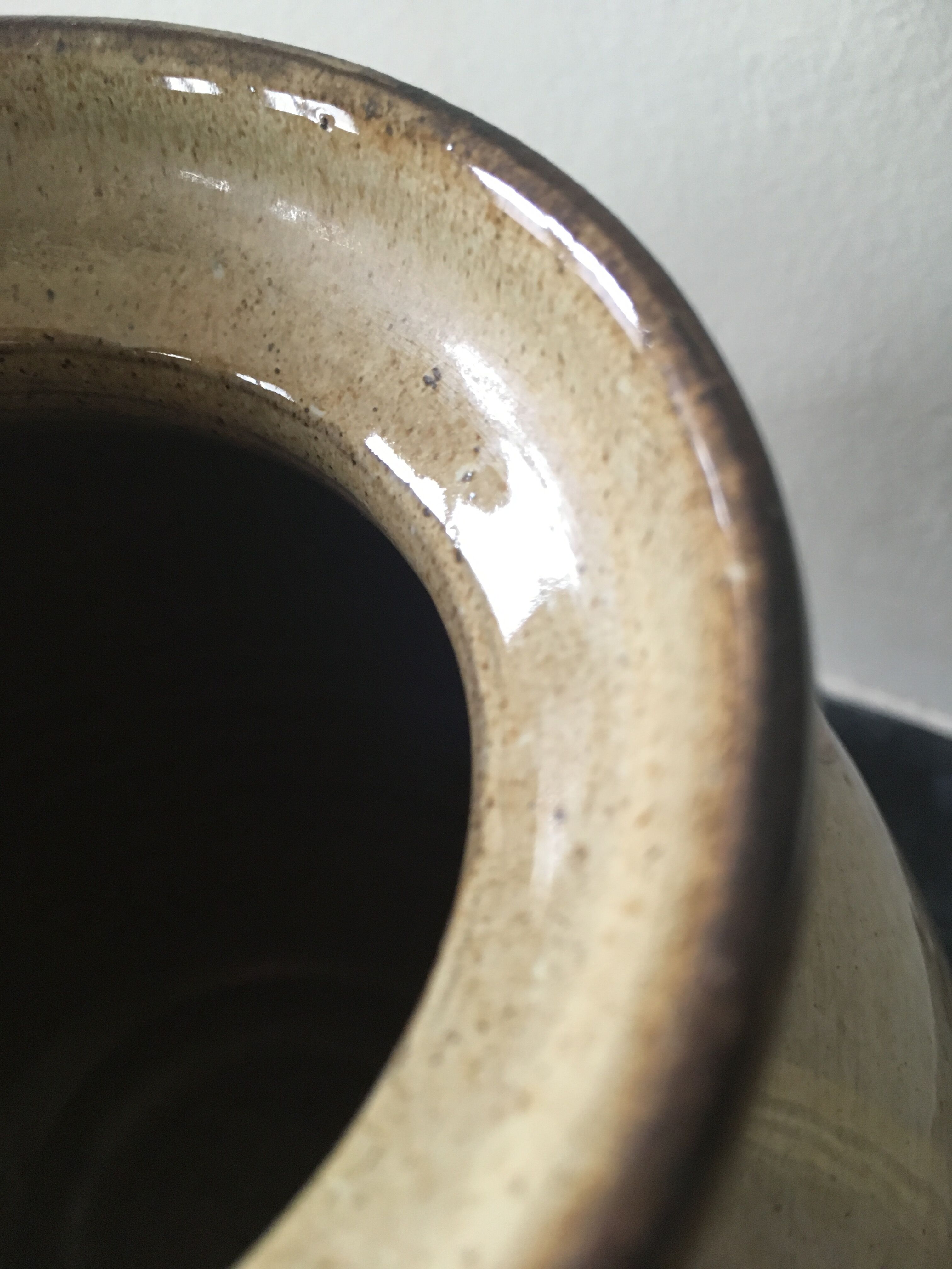 Glazed stoneware ball vase decorated with flowers