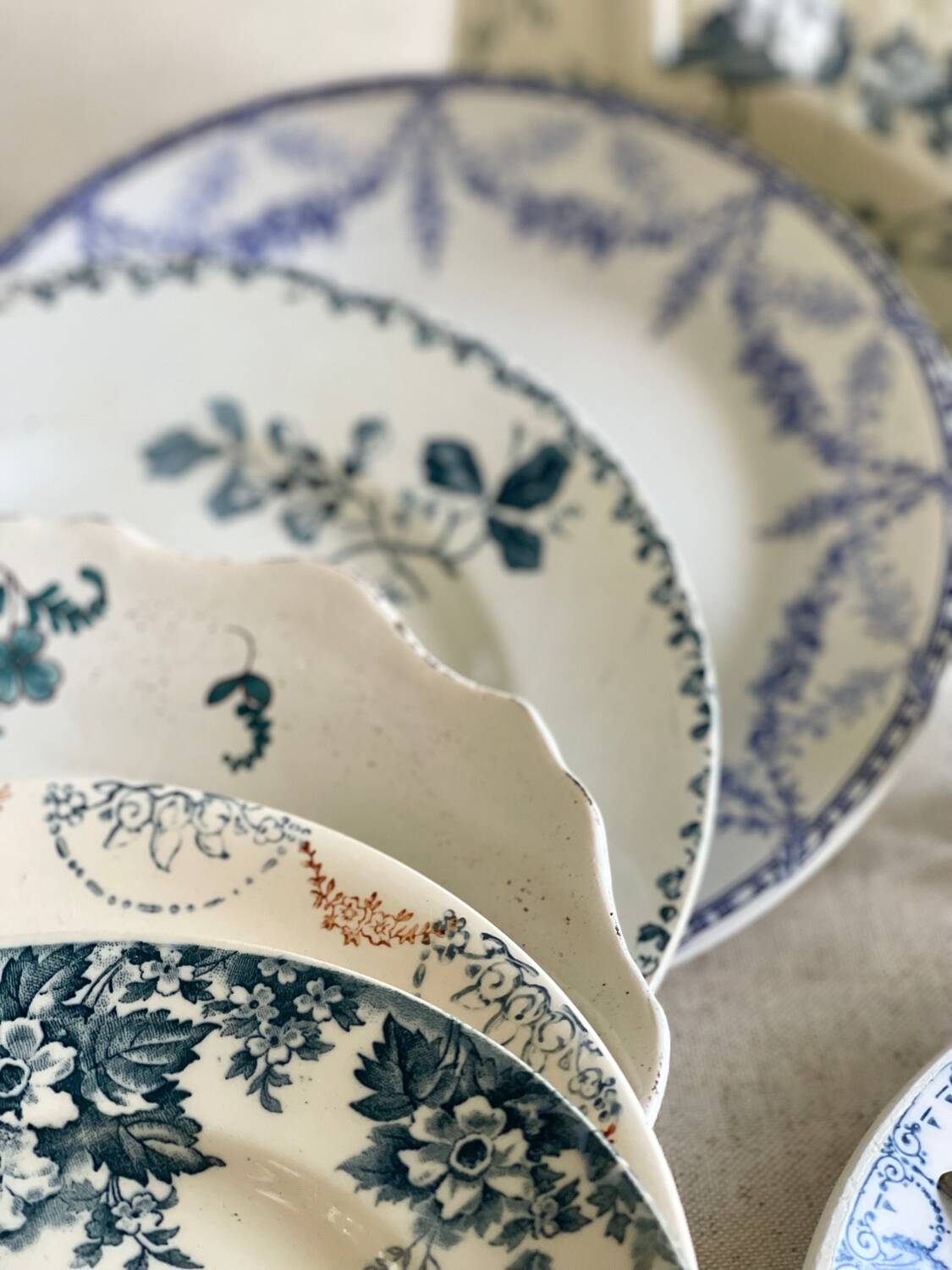 9 mismatched blue ironstone plates