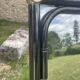 Vintage rectangular wall mirror in tubular metal and brass, 1970s/1980s.