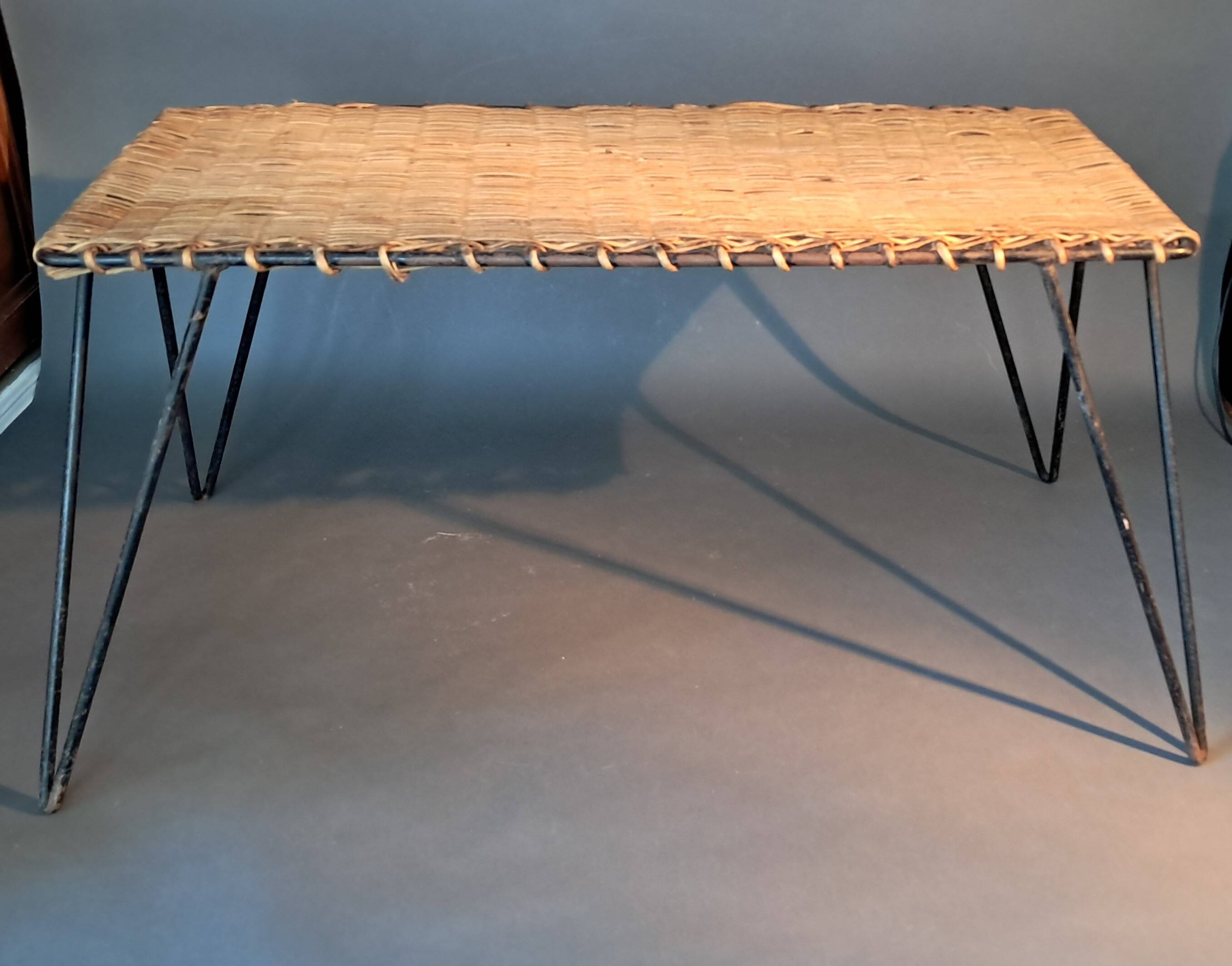 Vintage Raoul Guys coffee table in wicker and black metal, 1960.