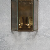 Wall sconce in brass and glass