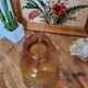 Artisanal blown amber glass vase with integrated honeycomb structure.