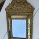 Miroir à parecloses en bois doré et métal repoussé
