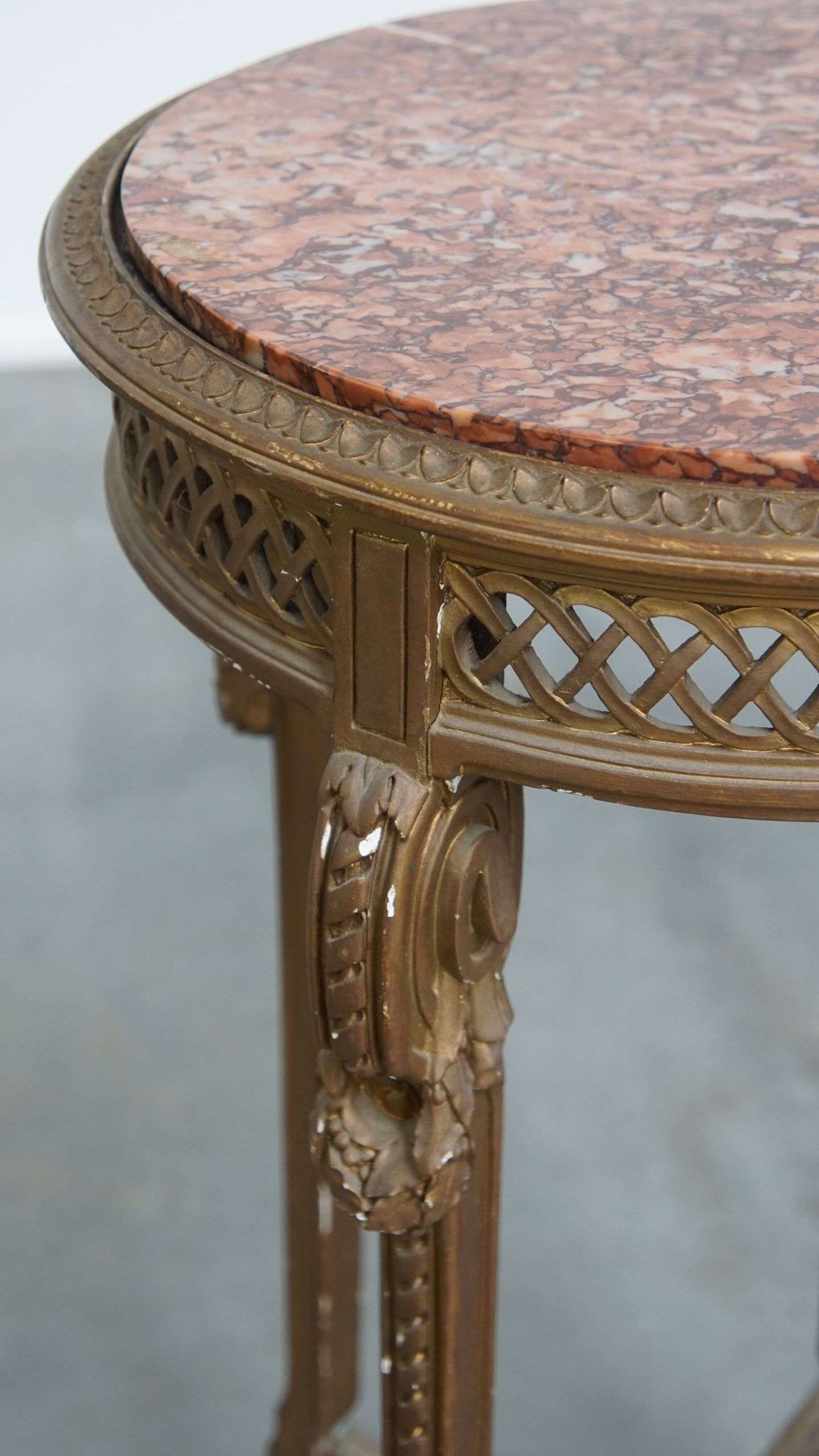 Antique French side table with a gold-coloured wooden frame and marble top