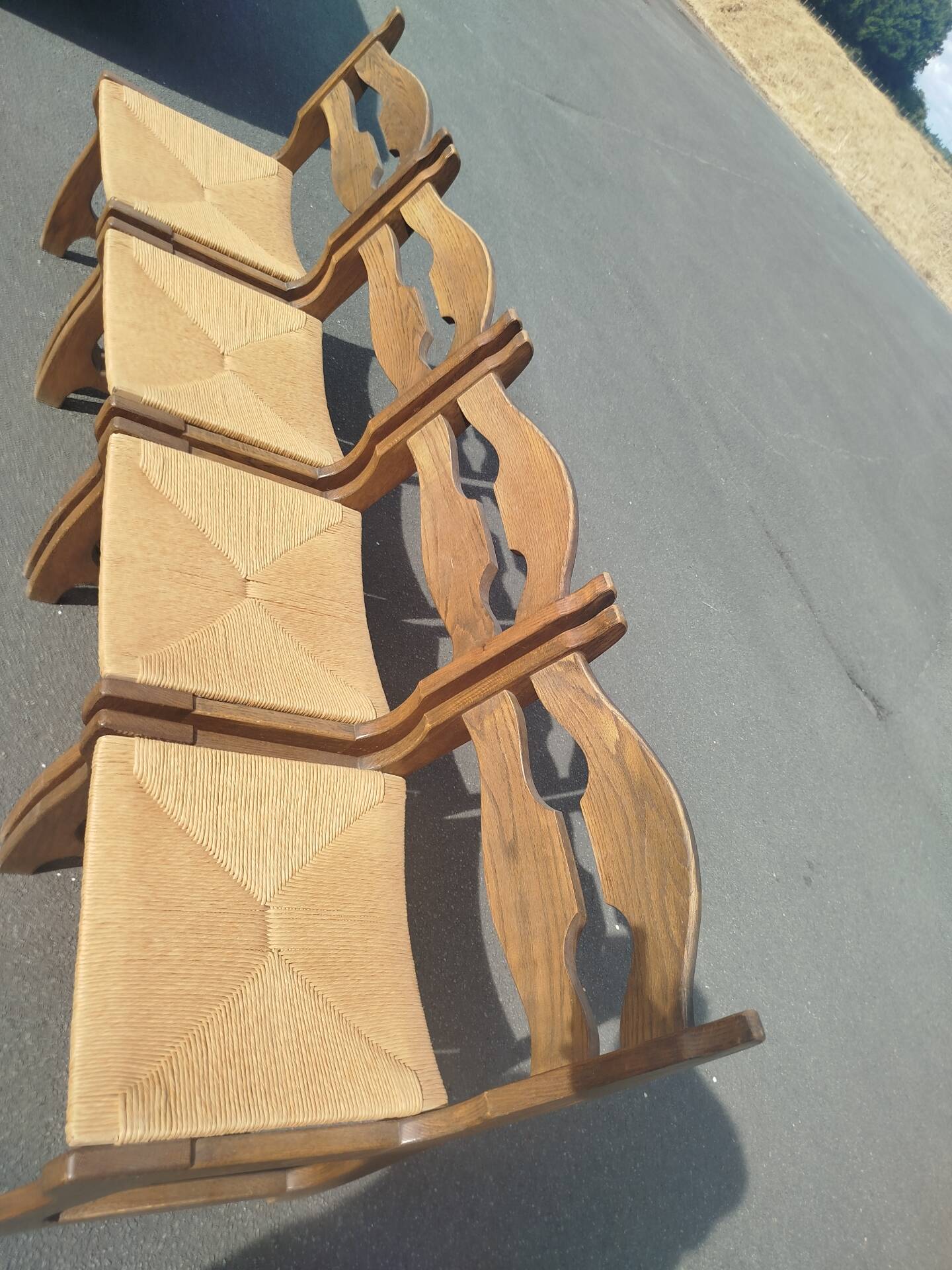 Set of 4 solid oak chairs with straw, in the style of Guillerm.