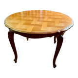 Round extendable wooden table with glass top