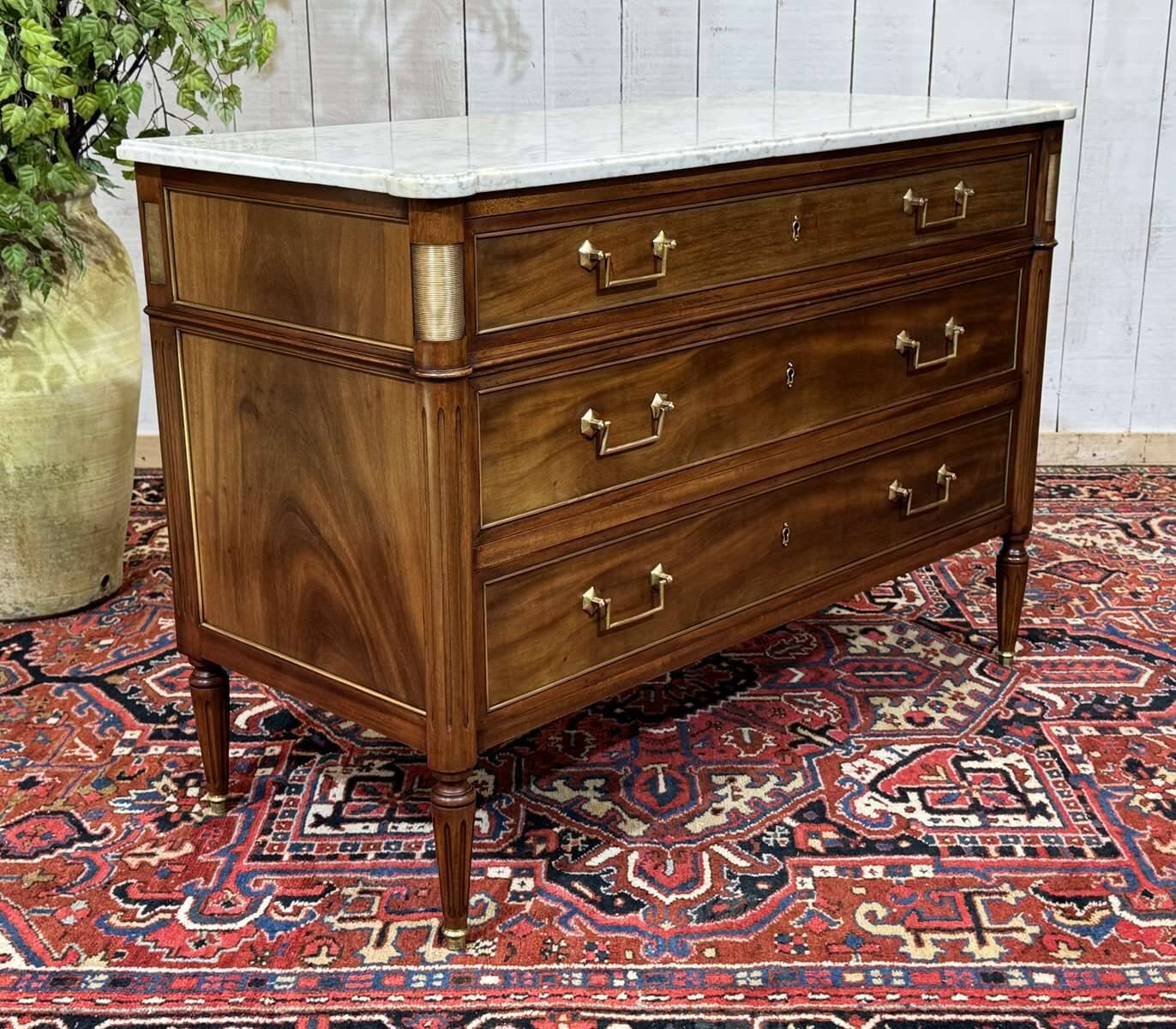 Louis XVI commode in mahogany with a marble top from the 1950s.