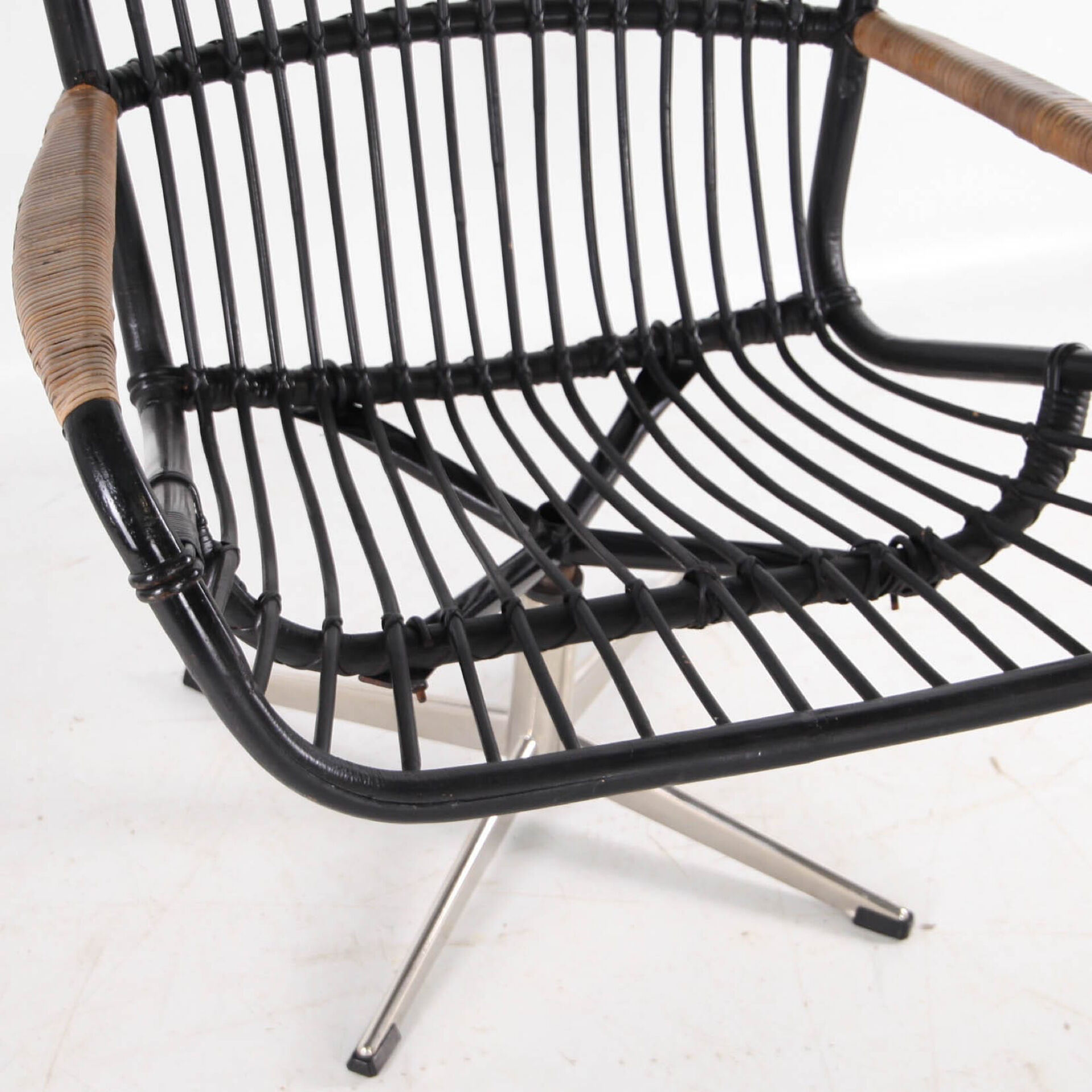 Rattan and chrome armchair