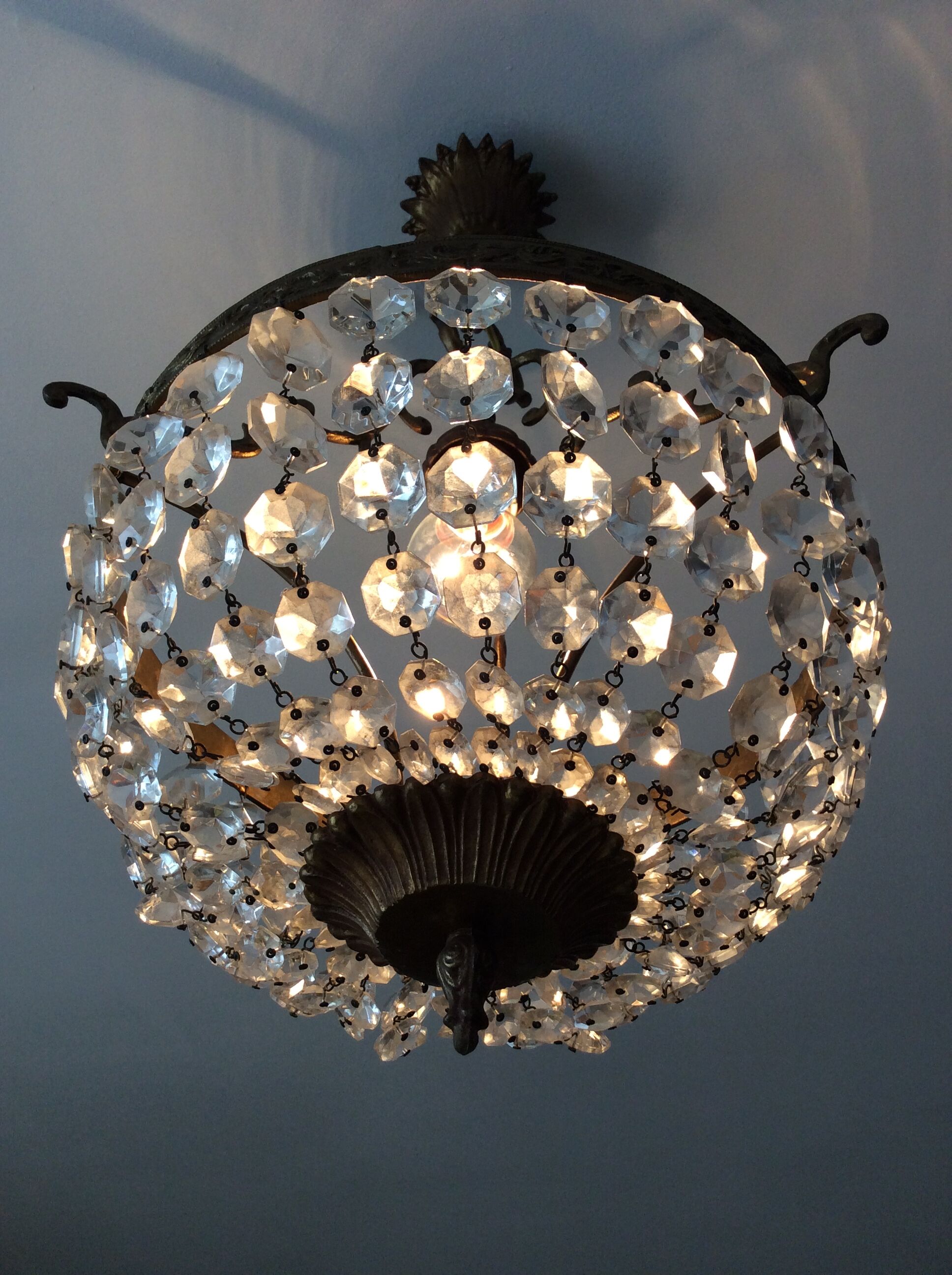 Old chandelier with bronze stamps