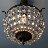 Old chandelier with bronze stamps