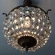 Old chandelier with bronze stamps