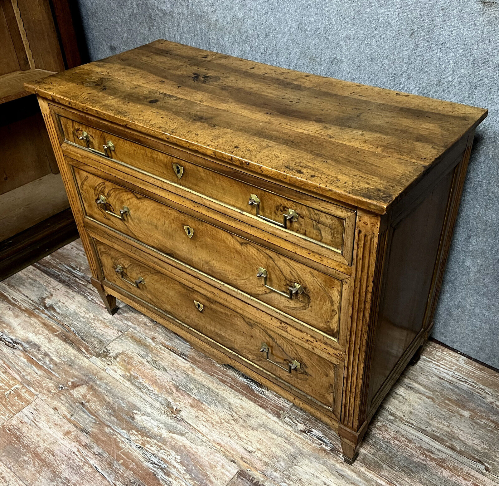 Louis XVI period chest of drawers in walnut and gilded brass nets circa 1780