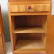 Art Deco bedside tables in oak with an inlaid marble top.