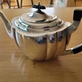 Chiseled silver teapot