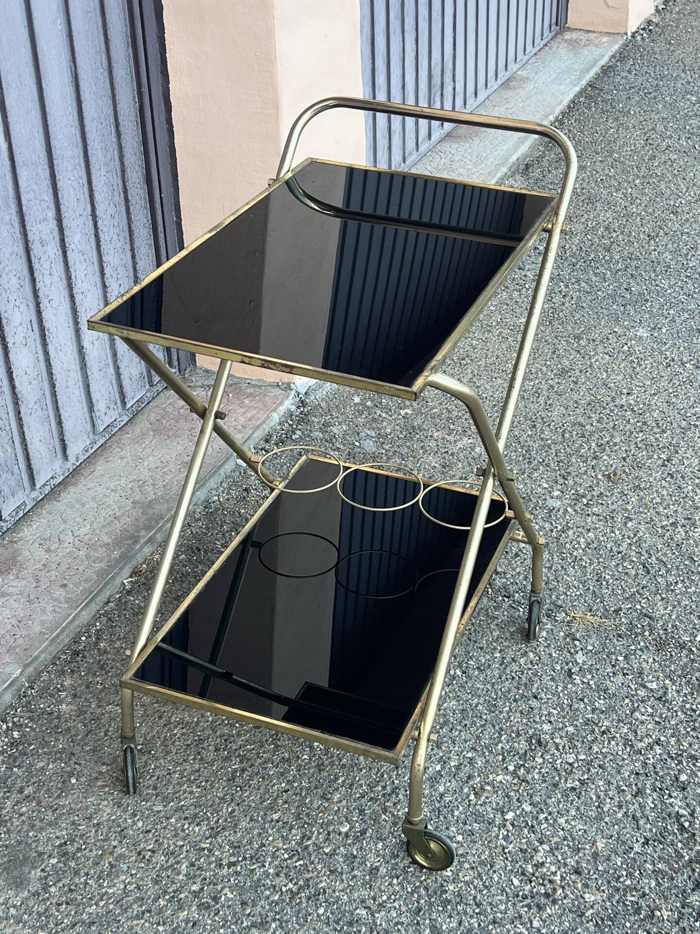 Vintage gold dessert bar with two black trays.