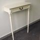 Two-legged wall console in Louis XVI style, painted wood.