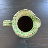 Old pitcher with ethnic decor